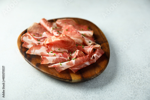 Delicious sliced smoked ham on a desk