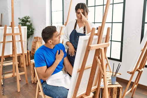 Teacher furious with paint student at art school.