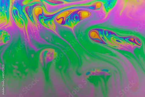 Defocused blurred abstract trendy neon colored psychedelic fluorescent striped background