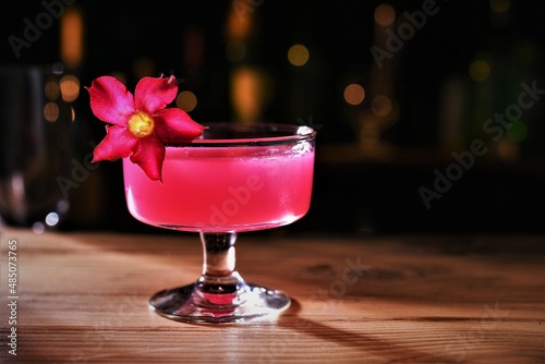 pink lady cocktail drink on wood table