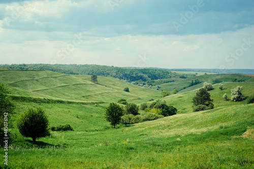 Beautiful summer landscape with green valley. © luengo_ua