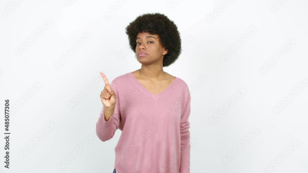 Young African American woman doing NO gesture over isolated background Young African American woman doing NO gesture over isolated background