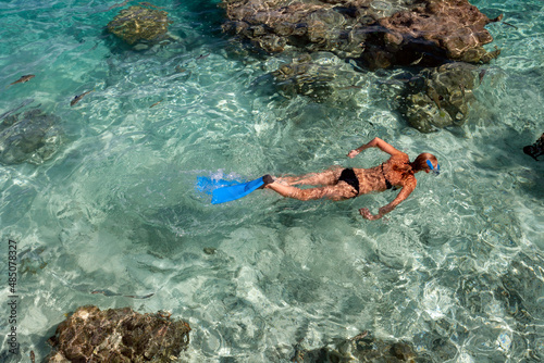 Snorkeling at a luxury resort on the tropical island of Mahini in French Polynesia in the South Pacific.