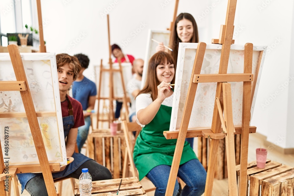 Group of young draw students smiling happy drawing at art studio. Group of young draw students smiling happy drawing at art studio.