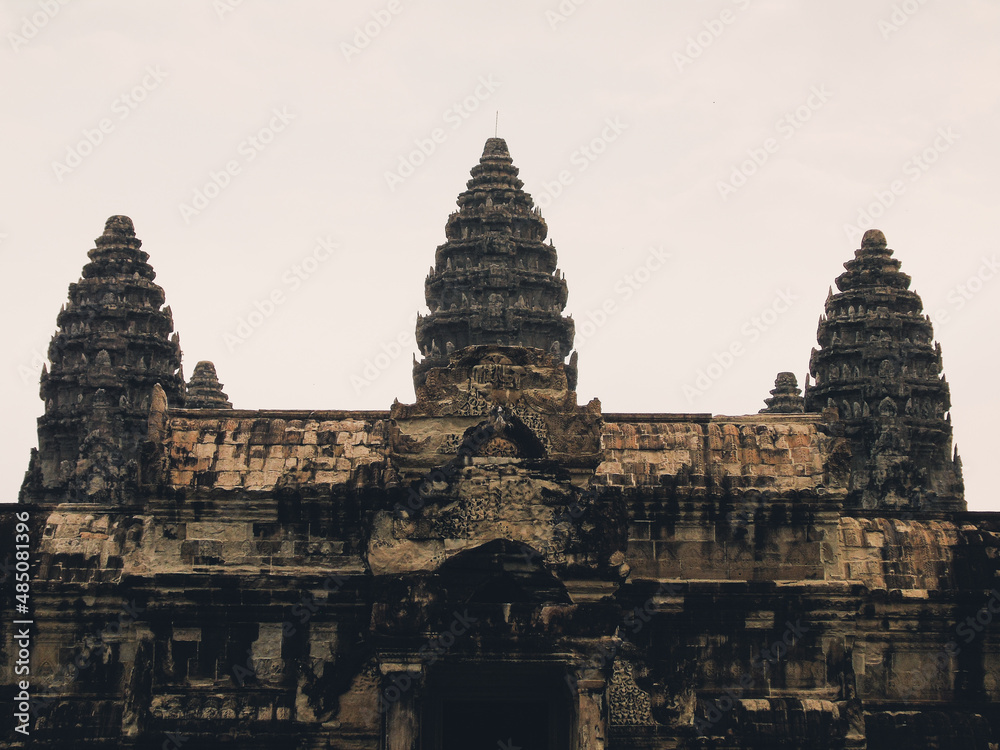 Fototapeta premium Ruins of an ancient stone temple lost in the Cambodian jungle - Angkor wat of Angkor temples