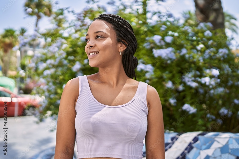 Young african american girl smiling happy standing at the city. Young african american girl smiling happy standing at the city.