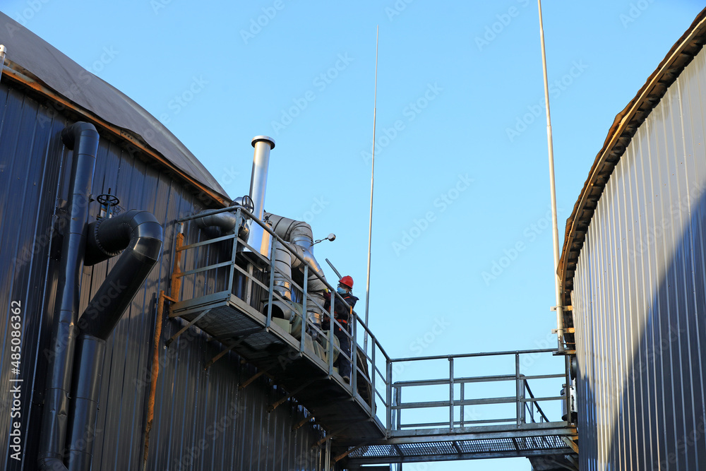 Workers conduct patrol inspection outside the anaerobic fermentation tank, North China