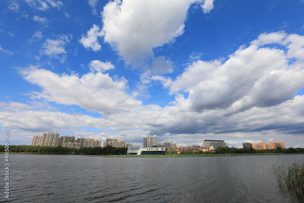 Sunny waterfront urban architectural scenery, North China