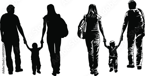 Black and white image of a young family walking with a child hand in hand