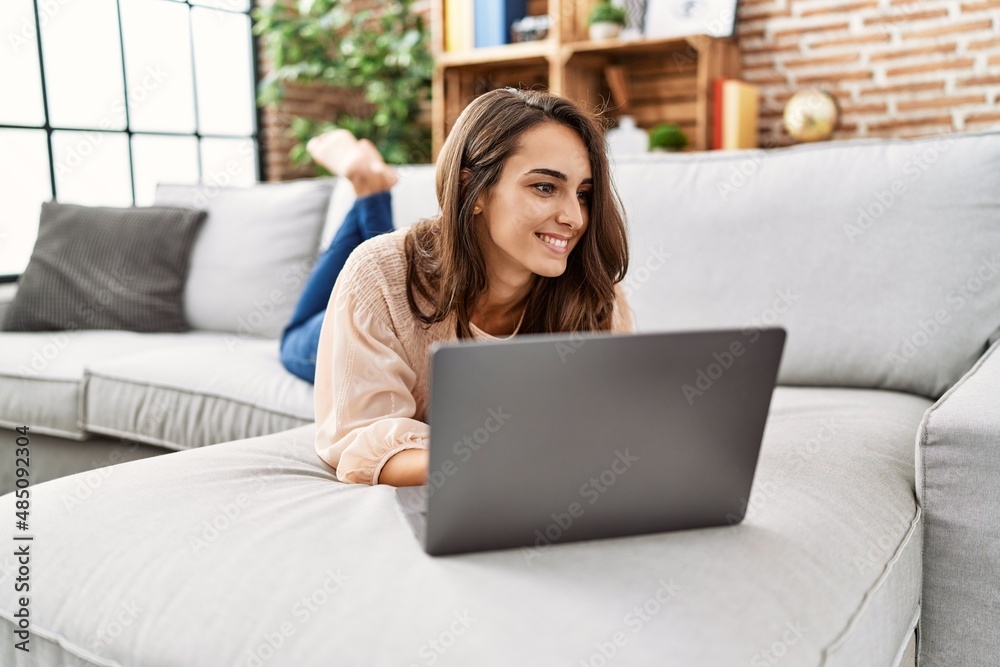 Young hispanic woman smiling confident using laptop at home Young hispanic woman smiling confident using laptop at home