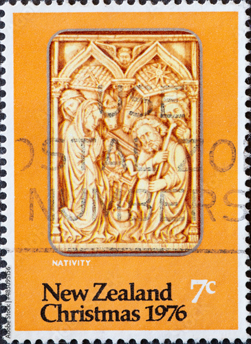 New Zealand - circa 1976: a postage stamp from New Zealand, showing Nativity, ivory carving. Christmas postage stamp 1976
