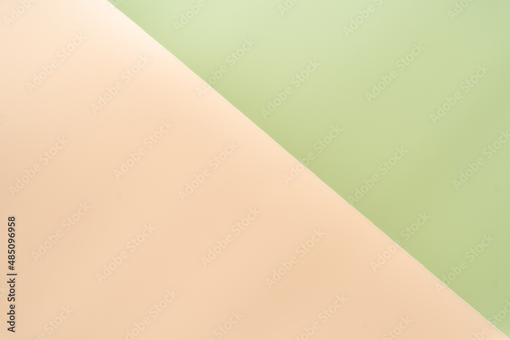 Background of two colors, light green and peach. Top view, wallpaper. Background of two colors, light green and peach. Top view, wallpaper.