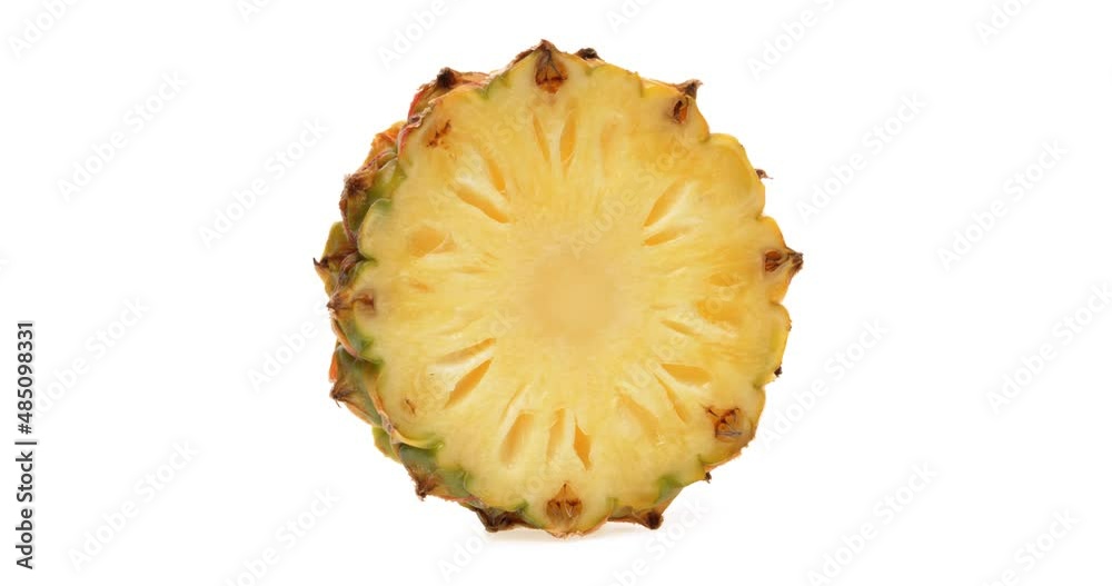 Pineapple slice rotating horizontally. White background. Pineapple slice rotating horizontally. White background.