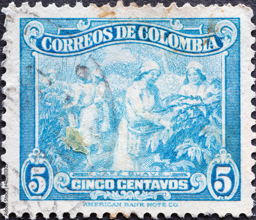 Colombia - circa 1944: a postage stamp from Colombia, showing women on the coffee plantation picking coffee.