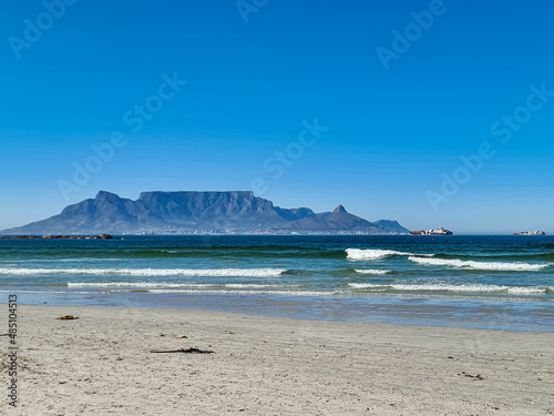 View of Table Mountain from Bloubergstrand beach on a clear summers day.