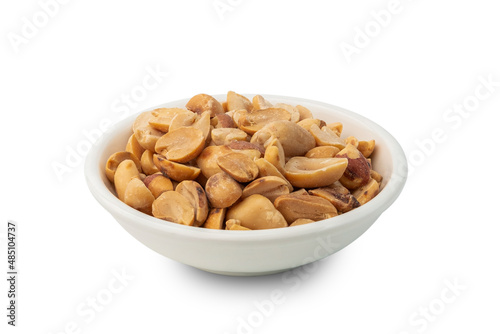 Roasted peanuts in white bowl isolated on white background with clipping path