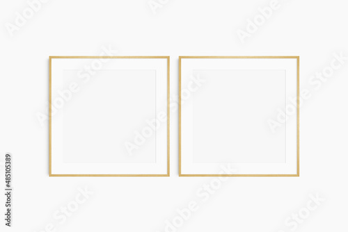 Frame mockup 1 1 square. Set of two thin oak wood frames. Clean  modern  minimalist  bright gallery wall mockup  set of 2 square frames with a mat opening.