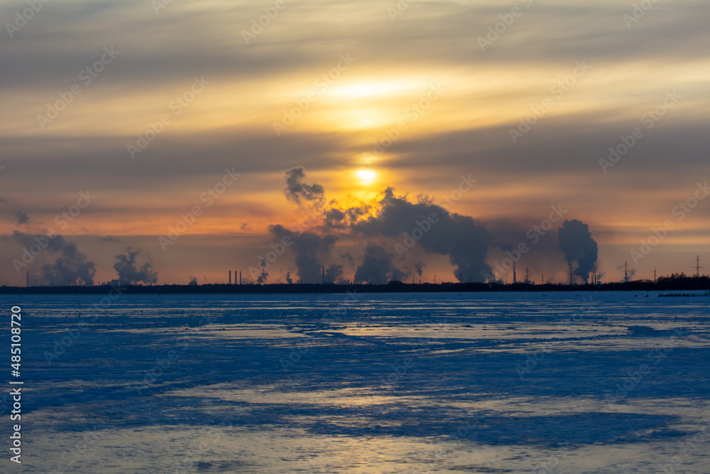 Smoke from the chimneys of a steel plant in winter Smoke from the chimneys of a steel plant in winter