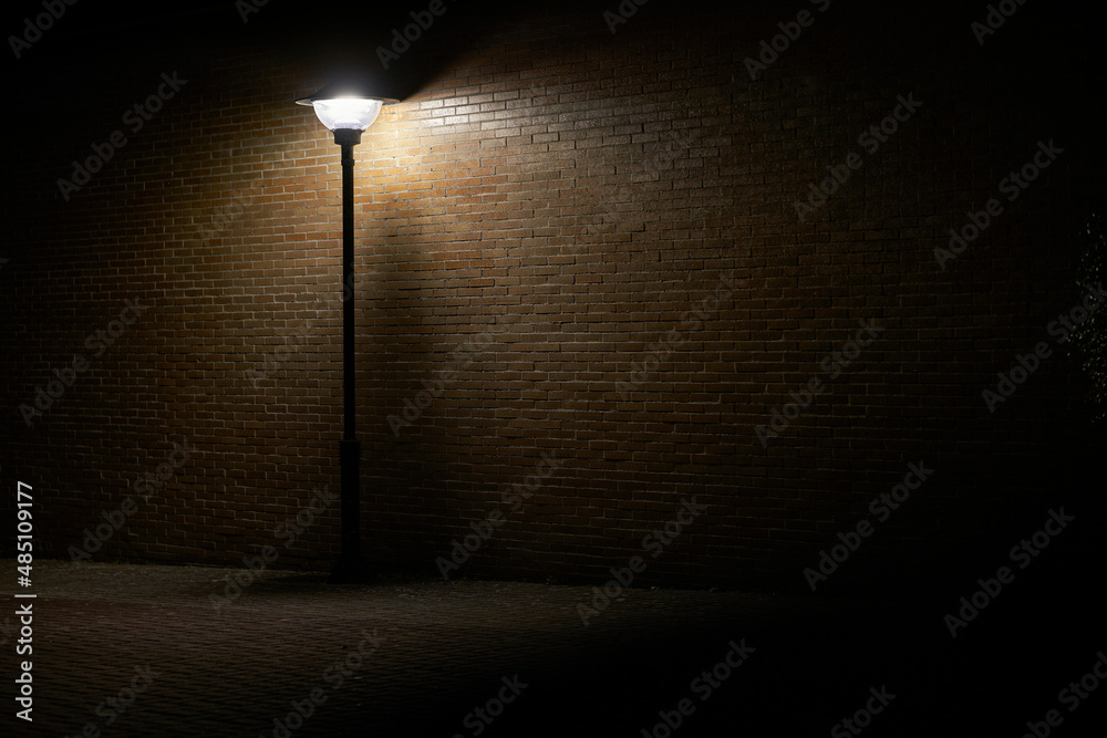 Beautiful and dark lonely street lamp illuminating dark place at night  Stock Photo | Adobe Stock