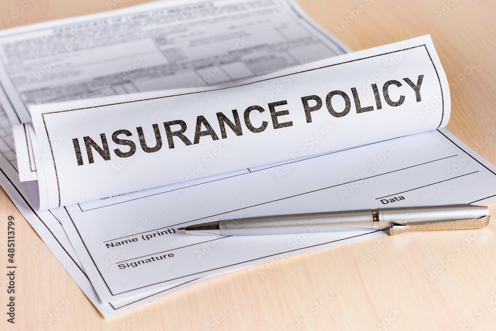 Insurance concept. Rolled up insurance policy and a pen on the table. Insurance concept. Rolled up insurance policy and a pen on the table.