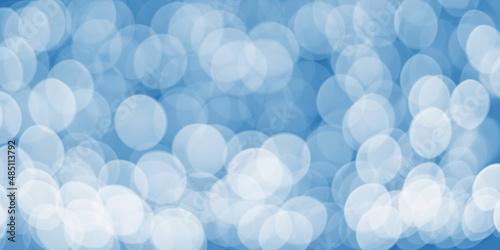 The concept of festive illumination and decoration - Christmas bokeh garland with illumination on a dark blue background. Abstract, blurred background.Panoramic image.