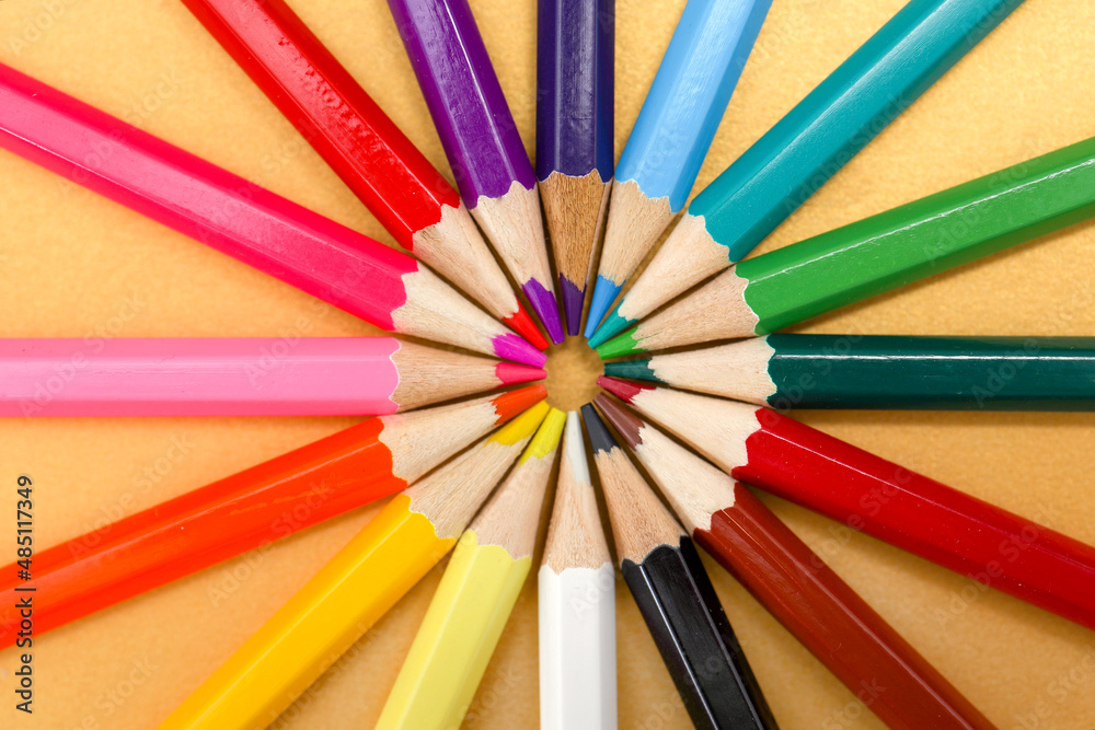 Set of colorful pencil arranged in a circle on yellow background. Set of colorful pencil arranged in a circle on yellow background.