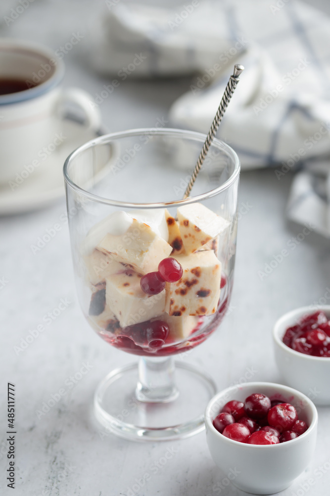 Leipajuusto - traditional Finnish baked cheese - with berries Leipajuusto - traditional Finnish baked cheese - with berries