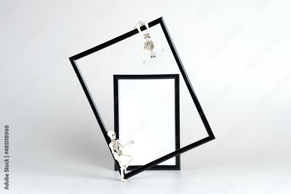 Decorated mockup with skeleton toy figures. Halloween photo frame