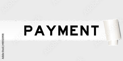 Ripped gray paper background that have word payment under torn part