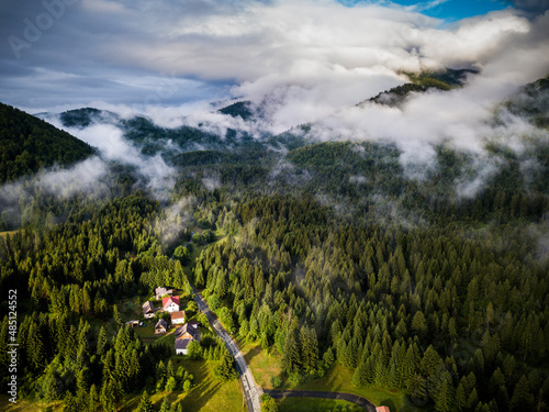 Morning landscape around the village of Jesenak after a summer storm lit by the sun with fog in Croatia, Europe photo