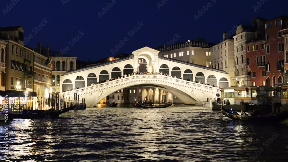 Venice, Veneto region, Italy. August 2018. Night on the Grand Canal with the waterbus. Filmed approaching the rialto bridge, the waterbus pitches. Venice, Veneto region, Italy. August 2018. Night on the Grand Canal with the waterbus. Filmed approaching the rialto bridge, the waterbus pitches.