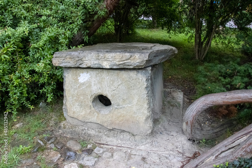 A dolmen is a type of single-chamber megalithic tomb, usually consisting of two or more vertical megaliths supporting a large flat horizontal capstone or "table"