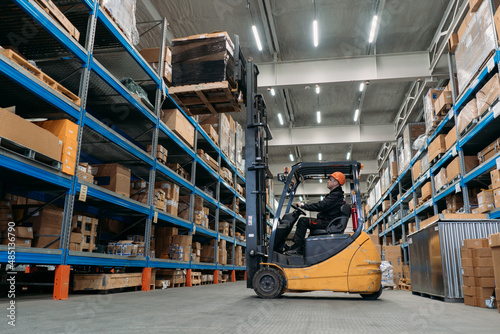 A forklift works in a warehouse.