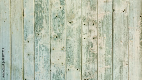 Background of old textured vintage cracked rough colorful white, blue, turquoise vertical wooden planks 