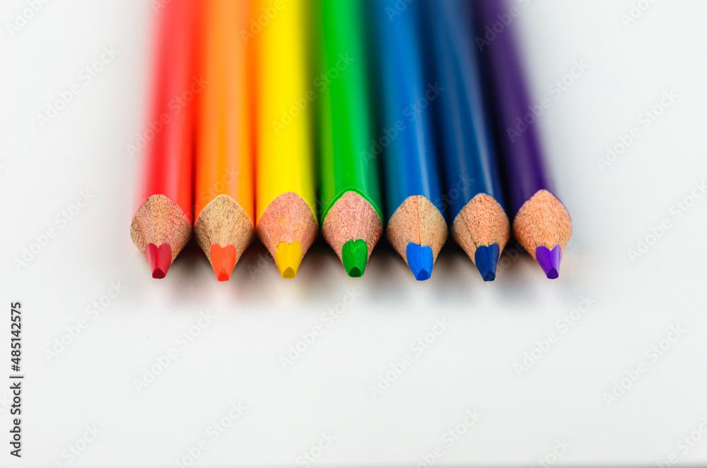 Rainbow colour pencils lying in a line close-up Rainbow colour pencils lying in a line close-up