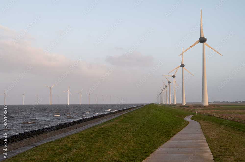 both offshore and onshore windmills. climate change concept of sustainable energy.