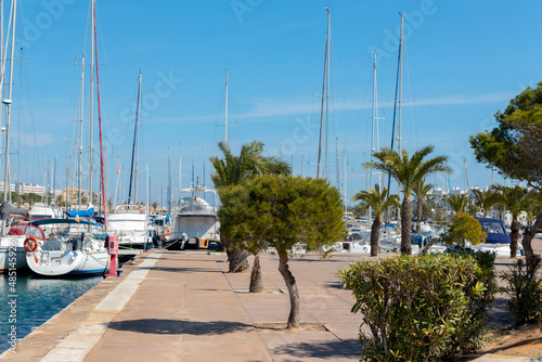 A beautiful marina with luxury yachts and motorboats in the tourist seaside town in Spain © Q77photo