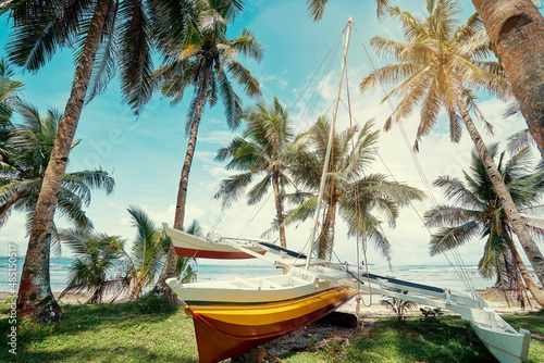 Beautiful landscape - tropical coconut palms beach with fishing boat. Siargao Island  Philippines.