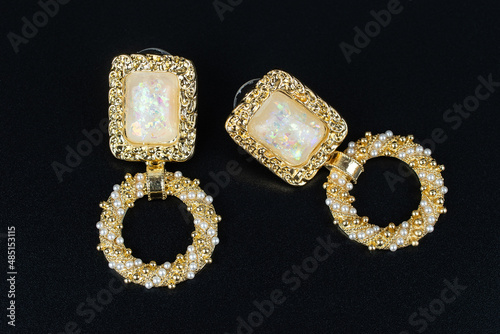 Jewelry earrings and costume jewelry on a black background
