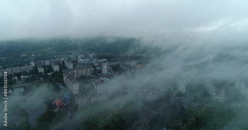 Top view of the city streets, the camera flies high above the city Top view of the city streets, the camera flies high above the city