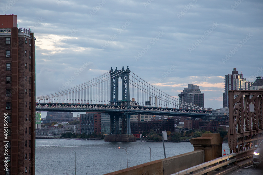 sunset view of Manhattan bridge from the Brooklyn bridge, New York city