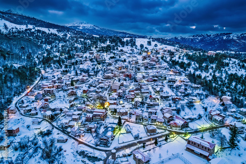 When night falls over snowy Smixi village, Vasilitsa mountain, Grevena, West Macedonia, Greece.