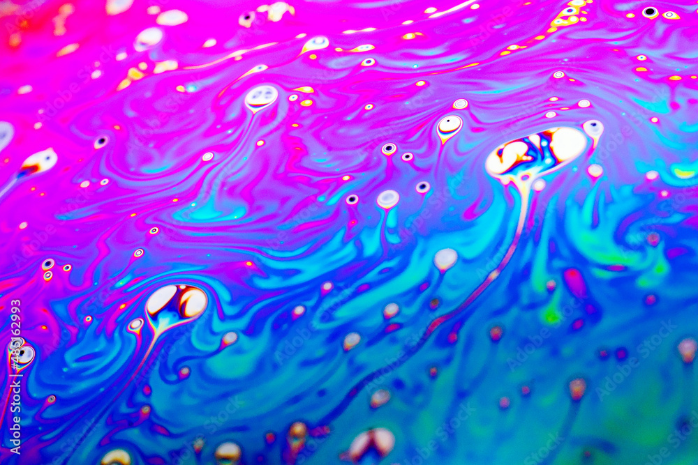 Beautiful psychedelic abstraction formed by light on the surface of a soap bubble Beautiful psychedelic abstraction formed by light on the surface of a soap bubble