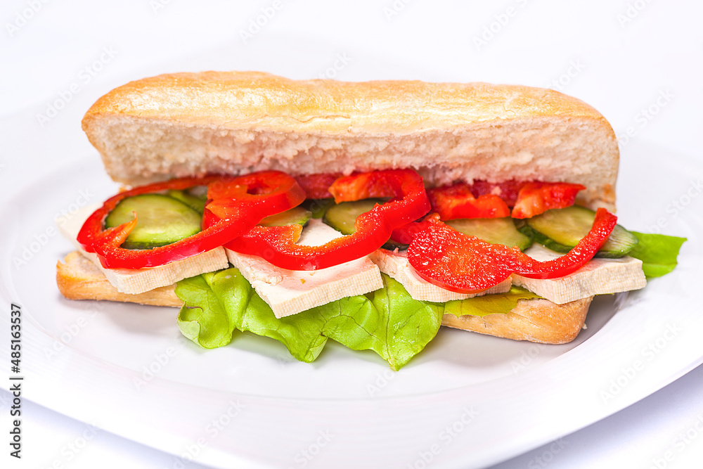 Sandwich plate made by a restaurant chef. Composition with bread pepper cucumbers cheese and salad. Sandwich plate made by a restaurant chef. Composition with bread pepper cucumbers cheese and salad.