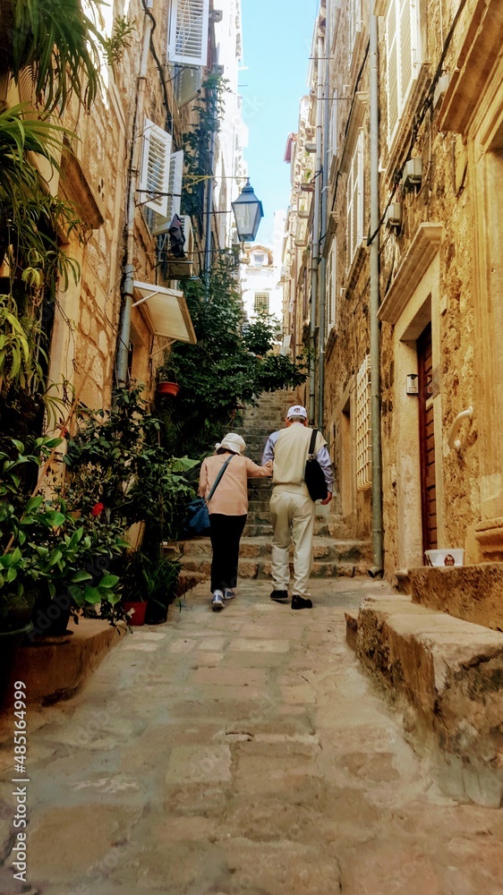 Couple walking in alley