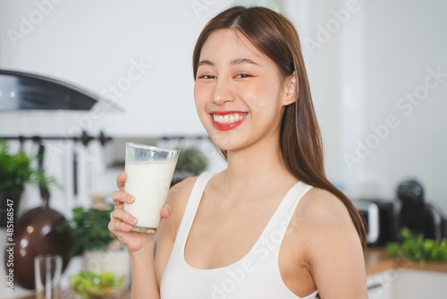 Close up person drinking a glass of milk