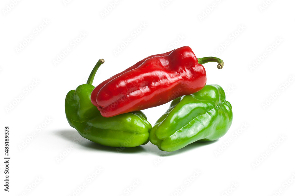 Three red and green peppers