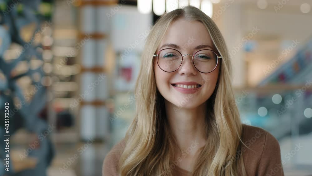 Head shot happy portrait caucasian girl in glasses young woman satisfied with ophthalmology services millennial blonde with healthy white toothy smile looking at camera confident model posing indoors