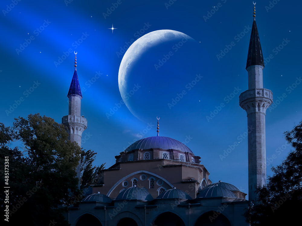Mosque on the background of the crescent and sky