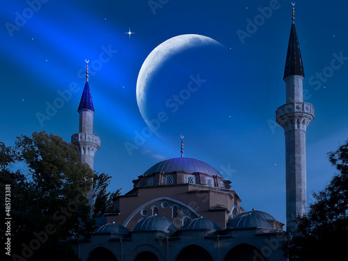 Mosque on the background of the crescent and sky